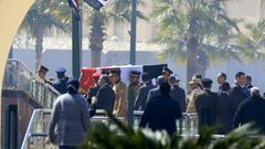 Egyptian honour guards carry the coffin of former president Hosni Mubarak before his funeral ceremony at Cairo's Mosheer Tantawy mosque in Cairo