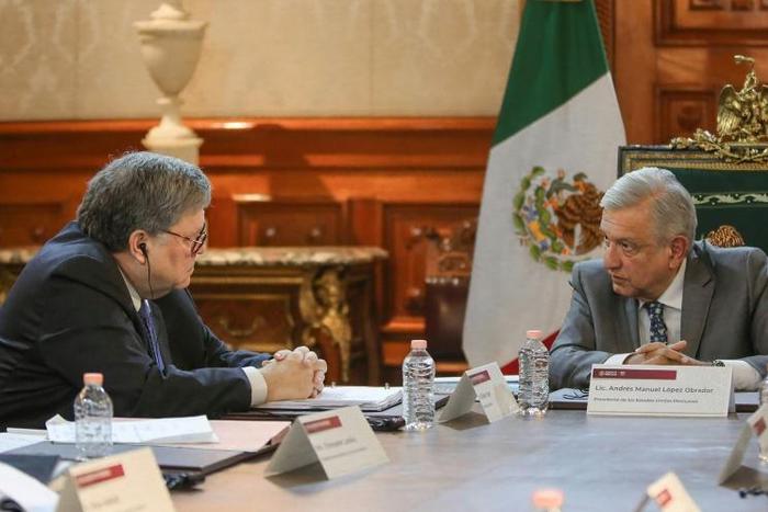 A photo released by the Mexican presidency shows President Andres Manuel Lopez Obrador (R) and US Attorney General Bill Barr during a meeting at the Palacio Nacional, in Mexico City on December 5, 2019
