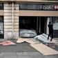 Demonstrators in Paris, some masked and hooded, broke shop windows along their route and threw projectiles at police in riot gear, who responded with tear gas