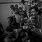 A Rohingya refugee reacts while holding his dead son after crossing the Naf river from Myanmar into Bangladesh on October 9, 2017, about two months after operations by the Myanmar military began