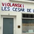 Posters with a play on words combining the word rape in French with the name of Polish-French filmmaker Roman Polanski, and reading "Violanski, the Cesars of shame" plastered on n the headquarters of the French film academy ahead of its 'Cesar' award