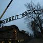 Merkel will walk through the infamous gate of the Auschwitz death camp