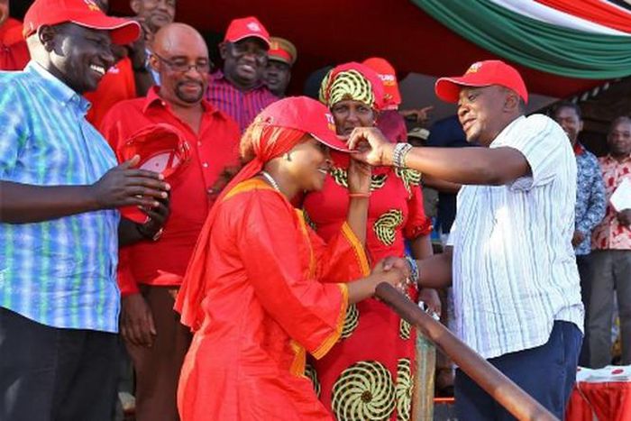 File image of President Uhuru Kenyatta and DP Ruto receiving Joyce Lay to the Jubilee party in 2017