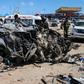 The blast left the wreckage of surrounding vehicles at the busy checkpoint and crossroads