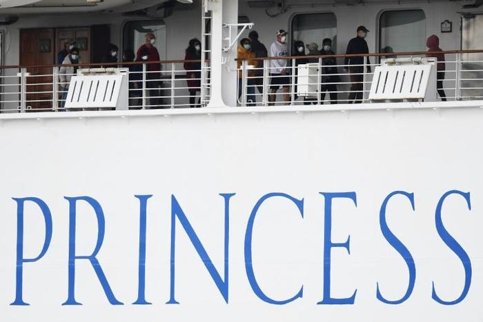 Passengers on the Diamond Princess are confined to their cabins except for brief outings on open decks wearing facemasks