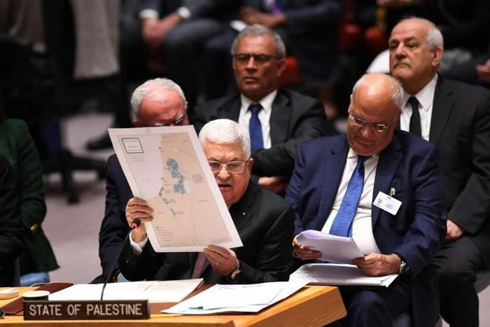 Palestinian president Mahmud Abbas holds up a map as he urges the UN Security Council to reject US President Donald Trump's Middle East plan