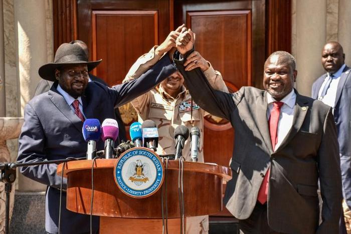 Bitter South Sudan Rivals Salva Kiir (left) and opposition leader Riek Machar (right)  at talks last year which have finally produced a new government