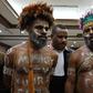 Papuan activists Ambrosius Mulait (left) and Dano Anes Tabuni speak to journalists during their trial in Jakarta