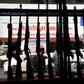 Guns are set up in a window display, located near the Terminal 21 shopping mall where a mass shooting took place in the northeastern Thai city of Nakhon Ratchasima