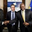 South Sudanese  presidential advisor Barnaba Marial Benjamin (L) shakes hands with the co-founder of South Sudan Reborn, Pagan Amum (R) as the Community of Sant'Egidio's International Relations Office Paolo Impagliazzo (C) looks on