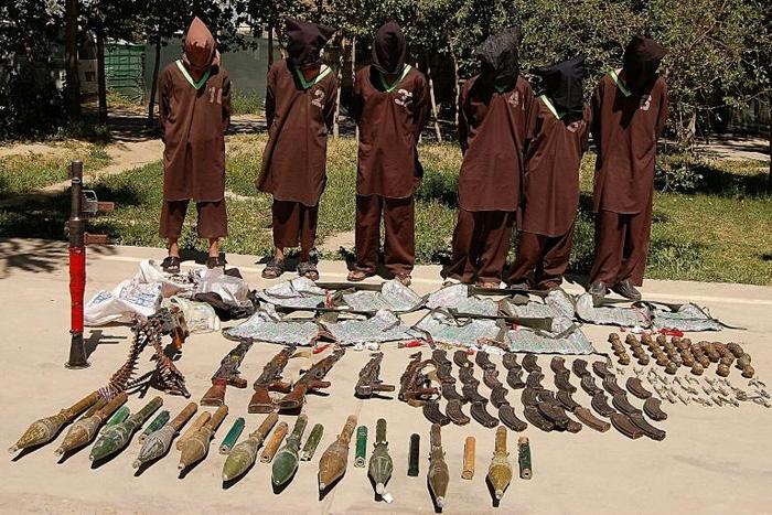 Haqqani network militants paraded with captured weapons in Kabul. The head of the network, who is also the deputy leader of the Taliban, said the group was fully committed to a peace deal with the United States