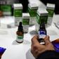 A man examines medicine containing cannabis at the start of the Expo Cannabis in Buenos Aires, Argentina, in October 2019.