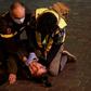 A Lebanese anti-government demonstrator receives first aid following clashes with riot police in the capital Beirut on December 14, 2019.