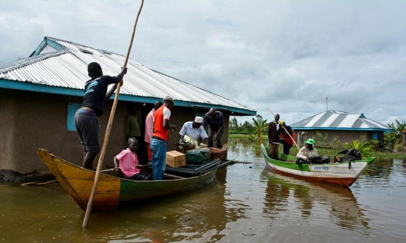 Rescue boats evacuate families after their houses were flooded in Kenya