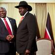 South Sudan's former rebel leader Riek Machar (left) meets with South Sudan's President Salva Kiir in October 2019