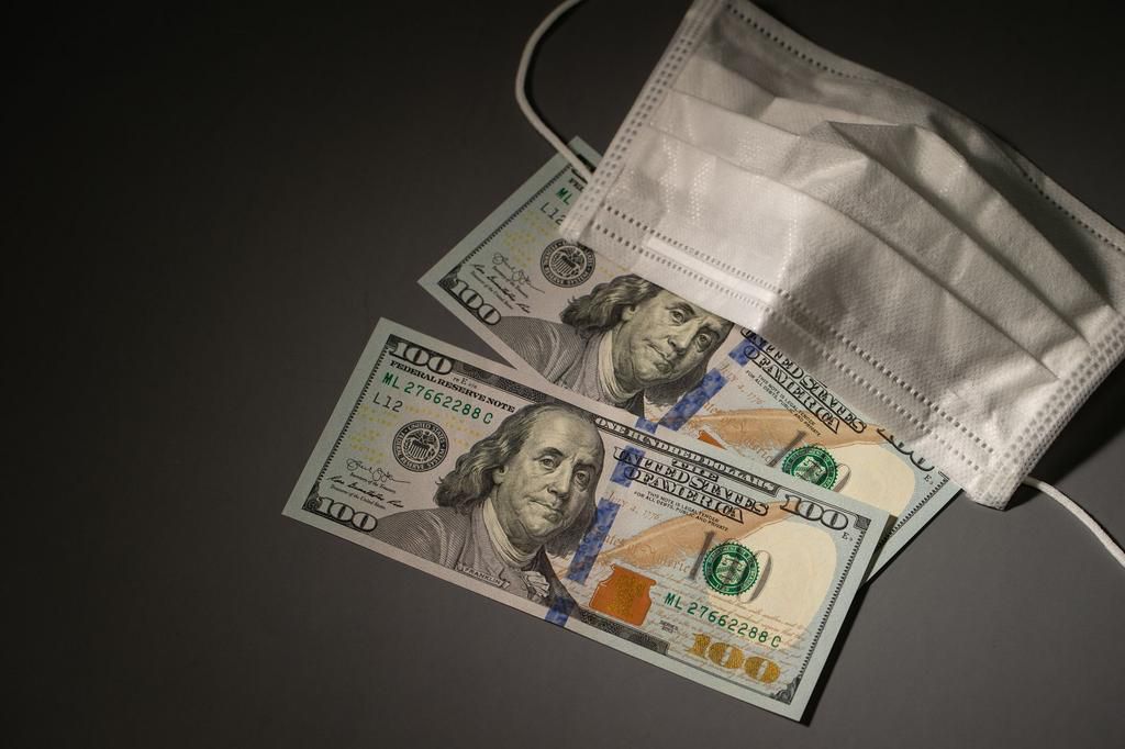US currency with mask