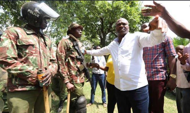 File image of Rashid Echesa surrounded by police at a past event