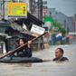 Some people took to paddling in small rubber lifeboats or tyre inner-tubes to get around