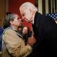 Democratic presidential candidate Joe Biden speaks to a supporter in Somersworth, New Hampshire