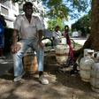 A man waits to replace an empty propane gas drum in Havana, on January 14, 2020: the Communist island is facing widespread fuel shortages in the wake of new US sanctions