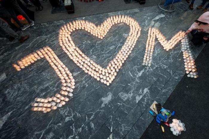 Candles were lit spellng out the love between, and for, Jan Kuciak and his fiancee Martina Kusnirova who were gunned down two years ago