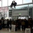 Activists formed a human chain to protest Black Friday sales at a shoping mall in the La Defense business district west of Paris, France, on Friday.