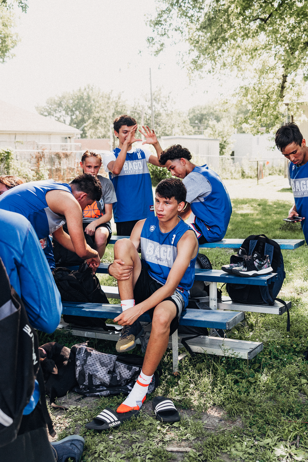 <strong>ASAIAS BERNIE TAKES</strong> a break with his teammates between scrimmages at The Slab in Winnebago, Nebraska on July 16, 2019. Left to right: Javon Price, Dyami Berridge, Lourde Kearnes, Asaias Bernie, Drew Parker, and Jeriah GreyOwl.