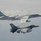 Taiwan's Defence Ministry issued a handout photograph showing one of its F-16 fighter jets flying next to a Chinese H-6 bomber