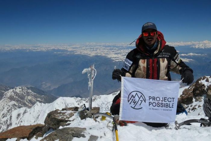 A picture released by Nirmal "Nims" Purja's Bremont Project Possible shows the climber on the summit of Gasherbrum II earlier in his quest to climb the world's highest 14 mountains This handout photo taken on July 3, 2019 and released by Nepali climber...