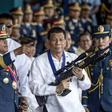 Philippine President Rodrigo Duterte's (C) signature anti-narcotics crackdown has killed thousands and drawn international condemnation