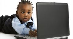 Toddler playing with laptop (Three Men On A Boat)