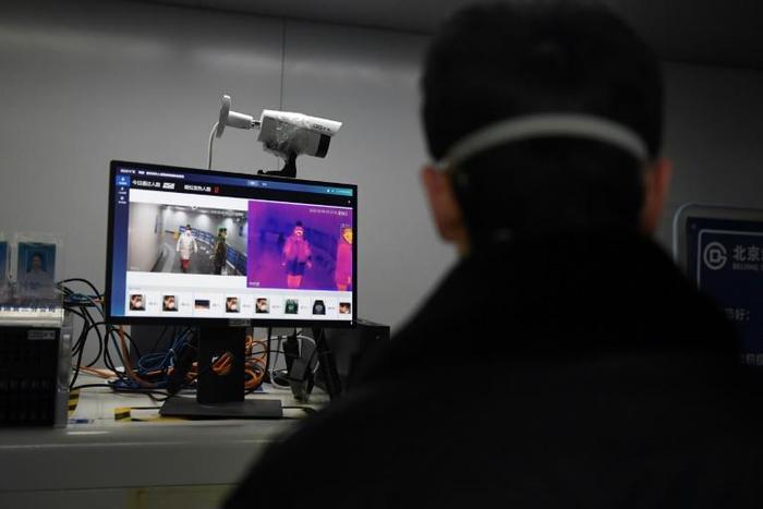 An AI-powered system developed by Megvii screens commuters for fever at a metro station in Beijing