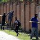 Authorities at work in  the El Mirador neighborhood of Tlajomulco de Zuniga in Jalisco, Mexico, where the remains of at least 50 people were found in a mass grave