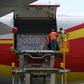 Workers unload supplies from an aircraft at Simon Bolivar International Airport outside Caracas in May 2019