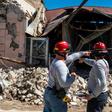 Two firemen survey a collapsed building after an earthquake hit Guanica, one of the towns which appeared to suffer the worst damage on Puerto Rico's southwest coast