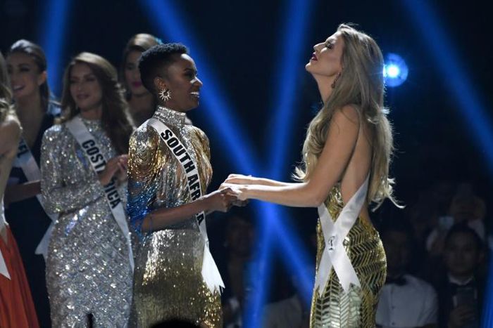 Miss South Africa Zozibini Tunzi (L) and Miss Puerto Rico Madison Anderson (R), the two finalists, wait to hear the winner's name on stage during the 2019 Miss Universe pageant at the Tyler Perry Studios in Atlanta, Georgia