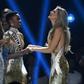 Miss South Africa Zozibini Tunzi (L) and Miss Puerto Rico Madison Anderson (R), the two finalists, wait to hear the winner's name on stage during the 2019 Miss Universe pageant at the Tyler Perry Studios in Atlanta, Georgia