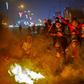 Iraqi anti-government protesters at a makeshift roadblock in the southern city of Basra