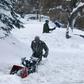 A trio digs out of the Green Mountain neighborhood on November 26, 2019 in Lakewood, Colorado