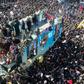 A truck carrying the coffin of slain Iranian general Qasem Soleimani makes its way through a sea of mourners in his hometown Kerman