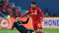 Toronto FC's Alejandro Pozuelo, evading a tackle attempt by DC United's Paul Arriola, has sparked the Canadian MLS squad in the wake of an injury to Jozy Altidore