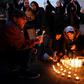 Iranians light candles for the victims of Ukraine International Airlines Boeing 737 during a gathering in front of the Amirkabir University in the capital Tehran on Saturday