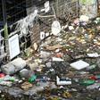 Bottles, styrofoam and other plastic waste thrown into the sea float by a pier in Singapore