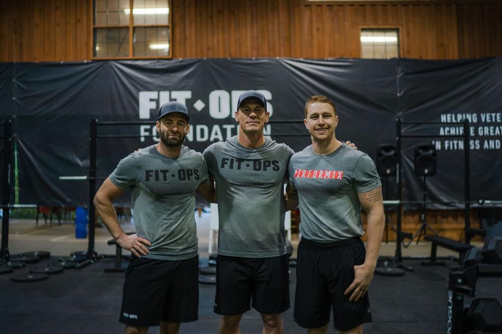 Bartell (right), with Cena (center), and FitOps founder Matt Hesse (left).