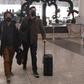Wall Street Journal reporters Philip Wen (left) and Josh Chin walk through Beijing Capital Airport after being expelled by Chinese authorities
