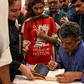 Author Mohammed Hanif signing copies of his book "A Case of Exploding Mangoes" in Islamabad in September 2019 after the release of its Urdu translation

Featuring bumbling generals, assassination plots, and homosexual romance, Pakistani military satire...