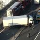 Armed police are shown surrounding a white van jackknifed across London Bridge after the incident