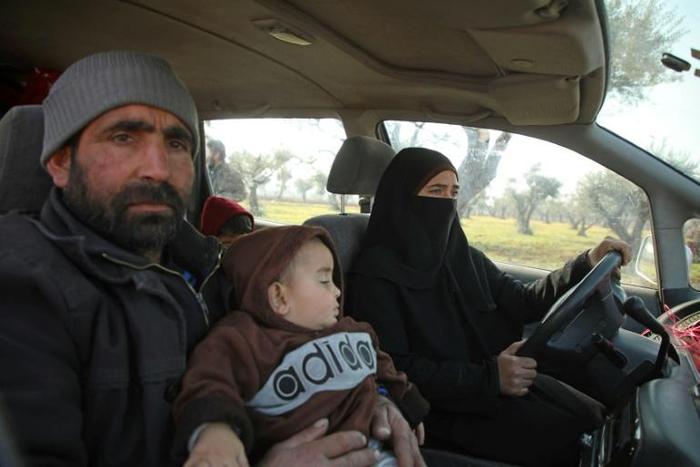Ghossoon drives her family in search of shelter in the town of Maaret Misrin town in Syria's Idlib province
