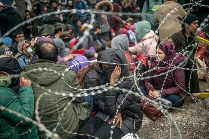 Through the barricades: Thousands of migrants have pushed up to the Turkey-Greece border