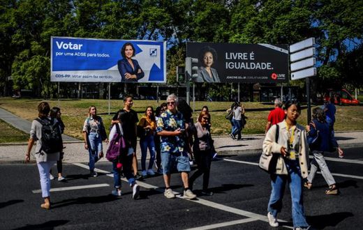 Anti-racism activist Joacine Katar Moreira, seen on the billboard on the right, is the best-known of the three new lawmakers